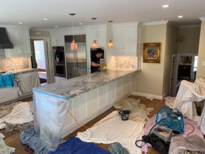 Cleaning and polishing a kitchen countertop in
