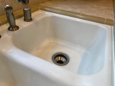 New caulking installed around a kitchen sink.